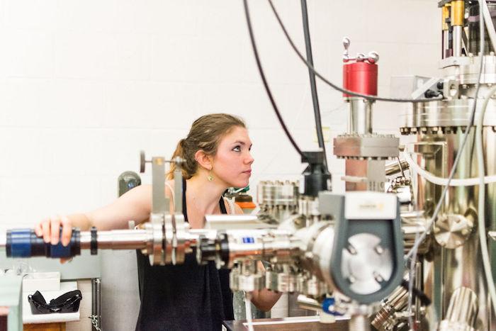 Bethany Matthews working with lab equipment