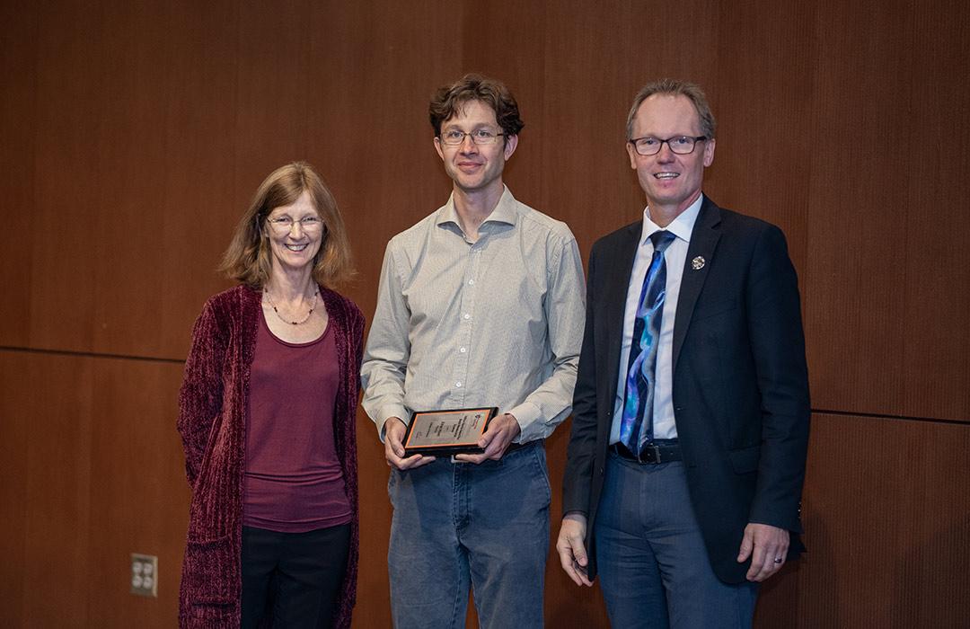 Ethan Minot receiving award from Janet Tate and Roy Haggerty