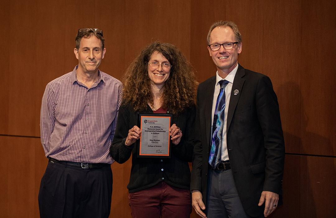 May Nyman receiving award from Michael Lerner and Roy Haggerty