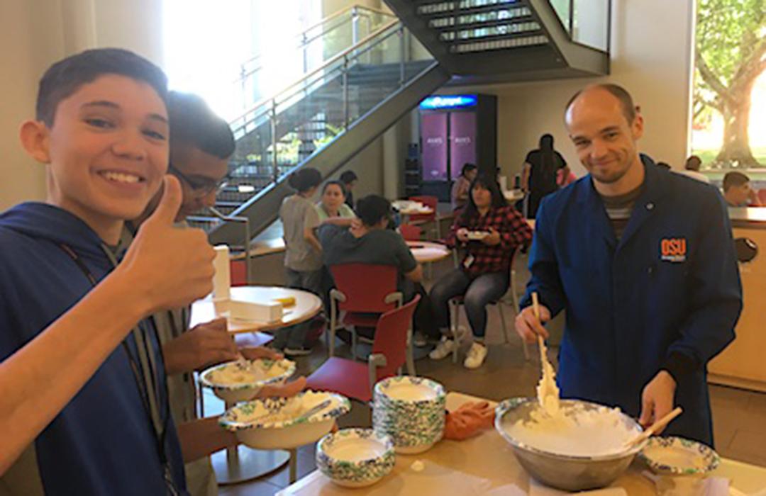 student being served liquid nitrogen ice cream