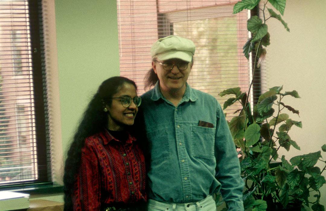 Kevin and Indira hugging each other in office space