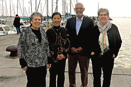 Heidi Schellman taking group chairmen in front of harbor