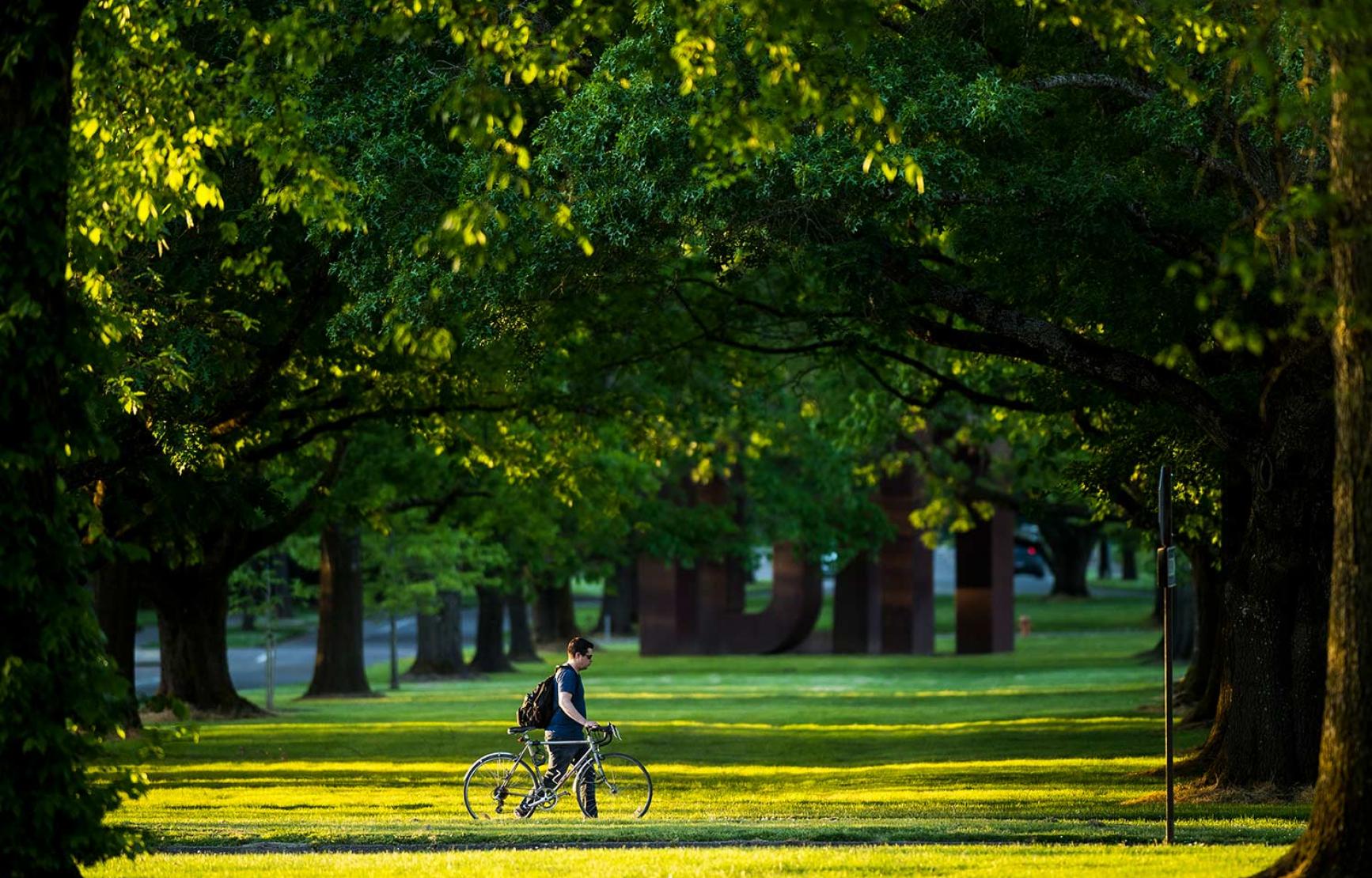 Walking bike outside West Hall lawn